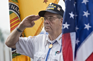 Korean War veteran Jack Keep, 78, of Front Royal salutes during the Presentation of Colors during the Veterans Tribute Thursday morning at the Shenanddoah County Fair.  Rich Cooley/Daily